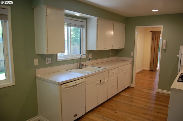 3024 Concord Way, Forest Grove, OR 97116 - kitchen featuring white dishwasher, a sink, white cabinetry, light wood-style floors, and light countertops