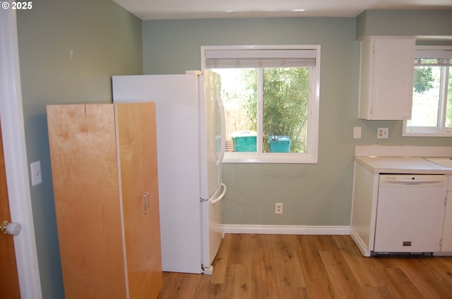 3024 Concord Way, Forest Grove, OR 97116 - kitchen featuring white appliances, light wood-style flooring, white cabinets, light countertops, and baseboards
