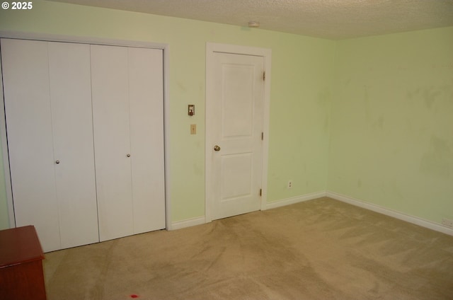 3024 Concord Way, Forest Grove, OR 97116 - unfurnished bedroom featuring carpet flooring, baseboards, a closet, and a textured ceiling