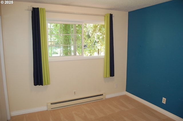 3024 Concord Way, Forest Grove, OR 97116 - carpeted empty room featuring a baseboard radiator, plenty of natural light, baseboards, and a textured ceiling