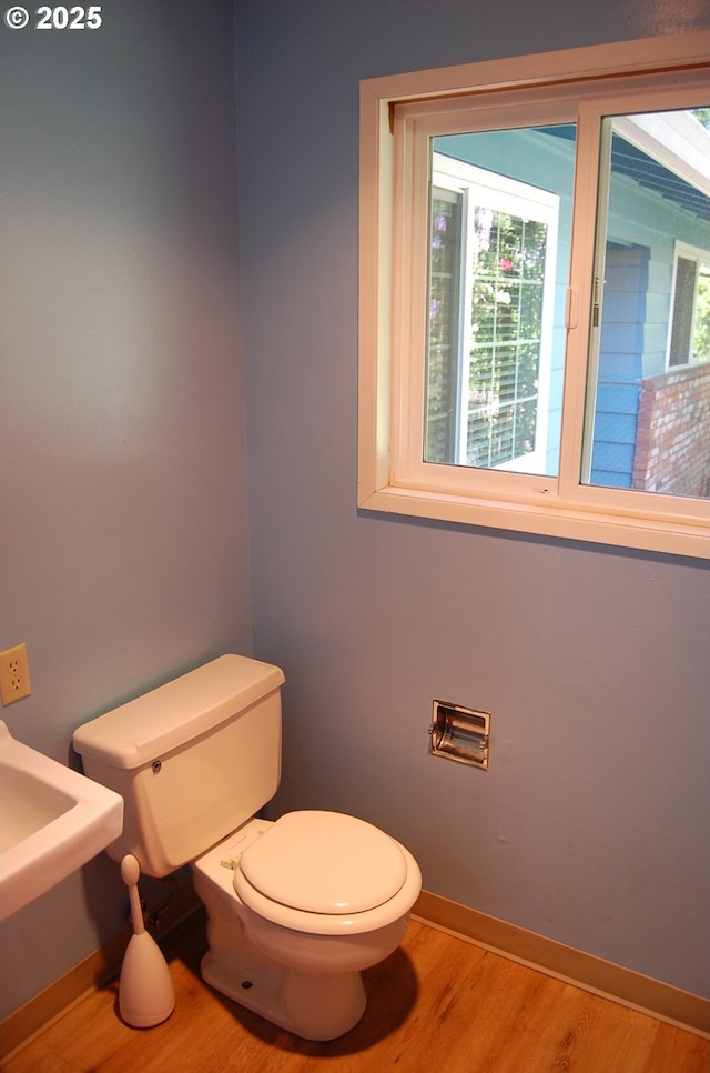 3024 Concord Way, Forest Grove, OR 97116 - half bathroom with plenty of natural light, toilet, wood finished floors, and baseboards