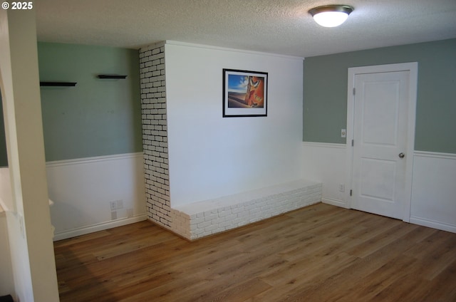 3024 Concord Way, Forest Grove, OR 97116 - unfurnished room featuring wainscoting, wood finished floors, and a textured ceiling