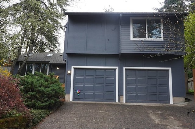 4768 Manzanita St, Eugene, OR 97405 - view of front of home with a garage and asphalt driveway