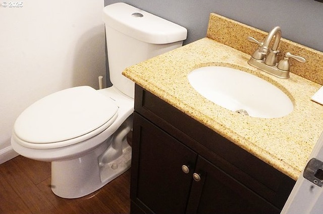 4768 Manzanita St, Eugene, OR 97405 - half bath with vanity, toilet, and wood finished floors