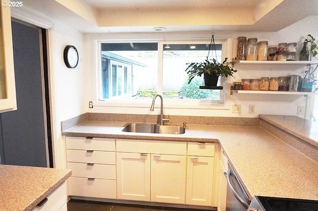 4768 Manzanita St, Eugene, OR 97405 - kitchen featuring a sink, stainless steel dishwasher, light countertops, a raised ceiling, and open shelves