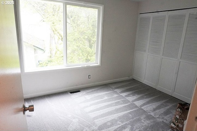 4768 Manzanita St, Eugene, OR 97405 - unfurnished bedroom with carpet flooring, a closet, and baseboards