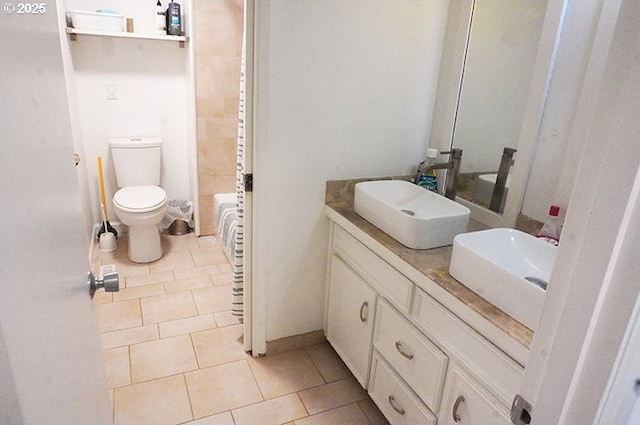 4768 Manzanita St, Eugene, OR 97405 - full bath featuring double vanity, tile patterned floors, and toilet