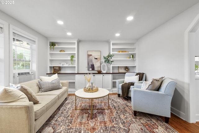 living room featuring cooling unit, recessed lighting, and wood finished floors