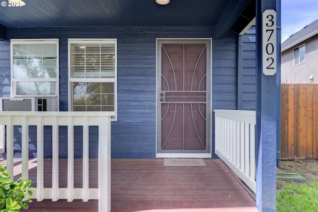 entrance to property featuring a porch