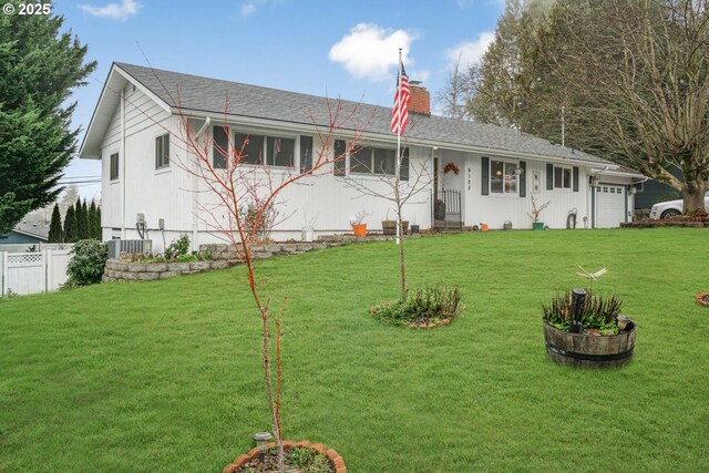 single story home with a garage, central AC, and a front lawn