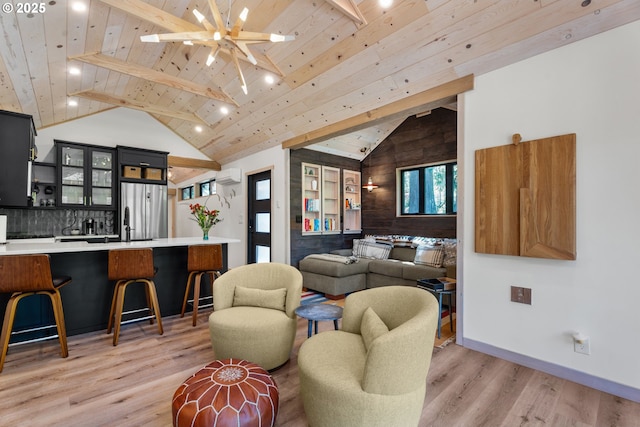 living area featuring an AC wall unit, wooden ceiling, light wood-style flooring, baseboards, and ceiling fan