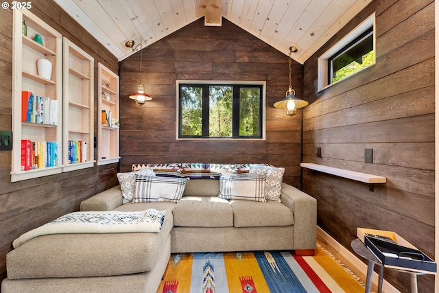 living room with wooden walls, lofted ceiling, and wood ceiling
