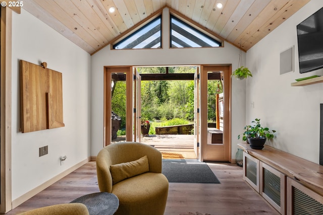 living area featuring recessed lighting, high vaulted ceiling, and wood finished floors