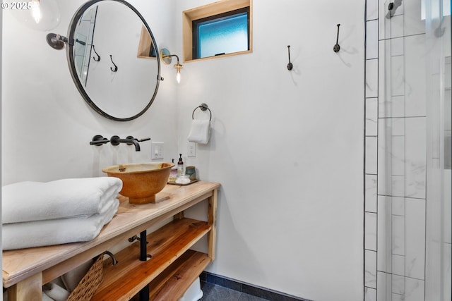 bathroom with a shower and vanity