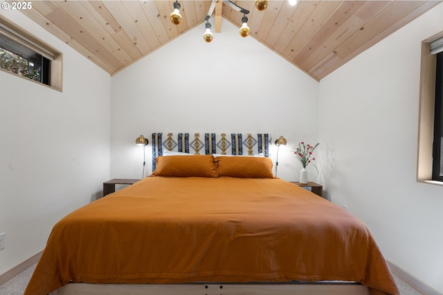 carpeted bedroom featuring vaulted ceiling, wood ceiling, and baseboards