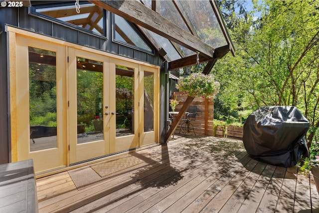 wooden deck featuring french doors and area for grilling
