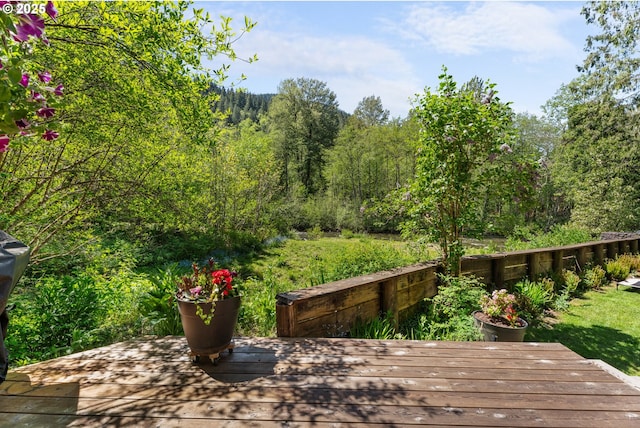 wooden deck featuring a wooded view