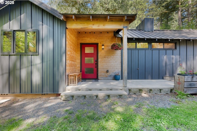 doorway to property featuring board and batten siding