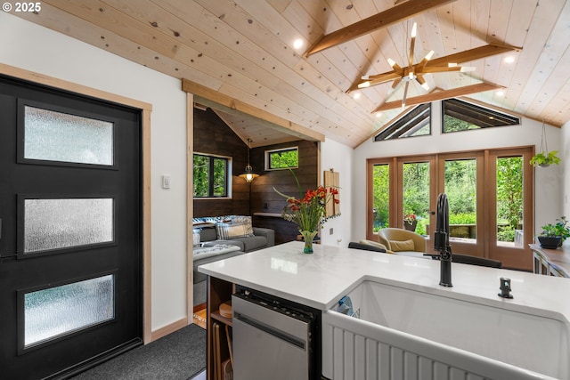 kitchen featuring a sink, open floor plan, vaulted ceiling, dishwasher, and wood ceiling
