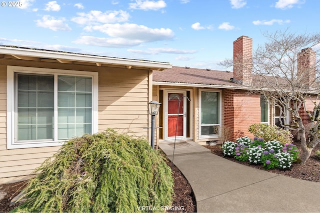 5016 SW Normandy Pl, Beaverton, OR 97005 - view of exterior entry featuring a chimney