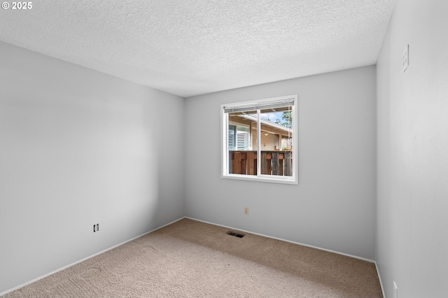 5016 SW Normandy Pl, Beaverton, OR 97005 - spare room featuring carpet, a textured ceiling, and baseboards