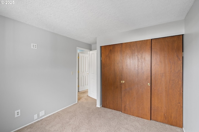 5016 SW Normandy Pl, Beaverton, OR 97005 - unfurnished bedroom with a closet, carpet floors, a textured ceiling, and baseboards