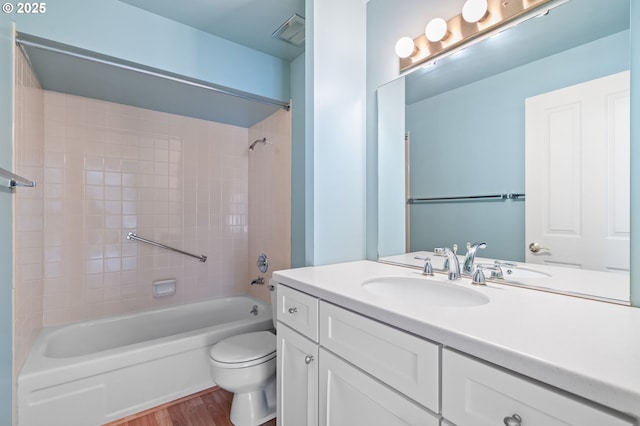 5016 SW Normandy Pl, Beaverton, OR 97005 - bathroom featuring vanity, wood finished floors, toilet, and bathing tub / shower combination