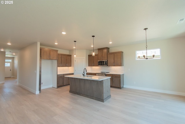 unfurnished living room featuring dark wood finished floors, a textured ceiling, a brick fireplace, and a sink