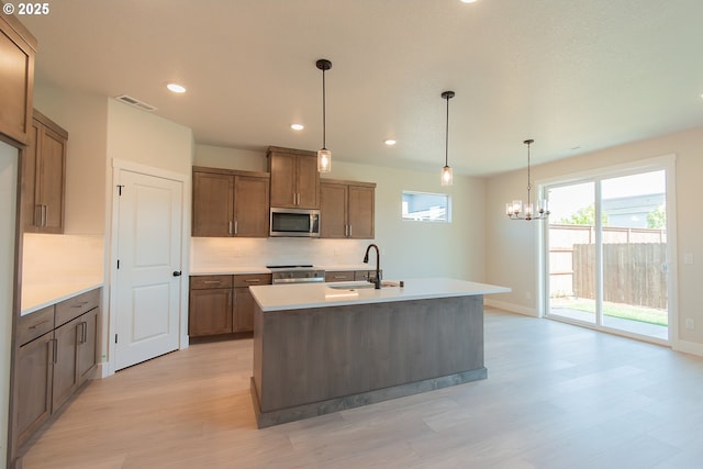 full bath featuring vanity, shower / bath combination, toilet, backsplash, and wood finished floors
