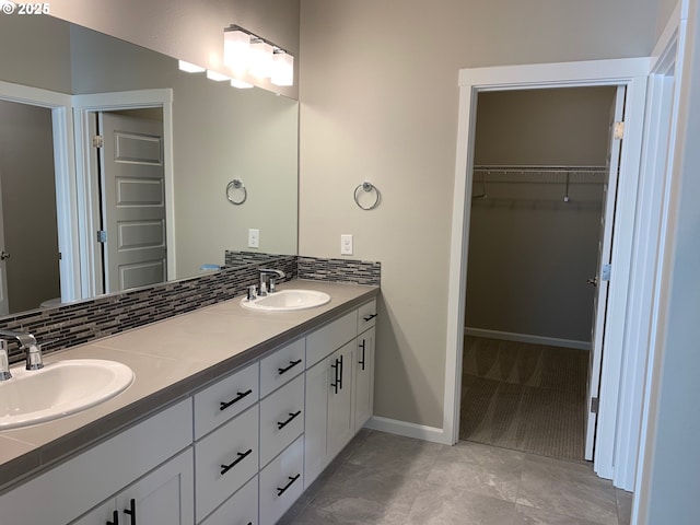 bathroom with vanity and decorative backsplash