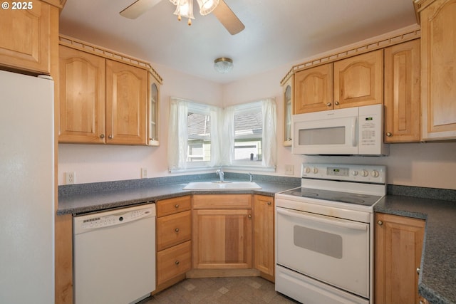 1108 4th St, Tillamook, OR 97141 - kitchen featuring white appliances, dark countertops, ceiling fan, glass insert cabinets, and light brown cabinetry