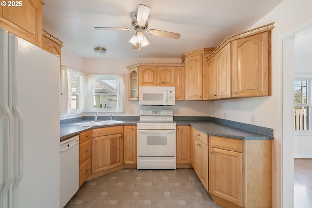 1108 4th St, Tillamook, OR 97141 - kitchen with white appliances, dark countertops, light brown cabinets, ceiling fan, and glass insert cabinets