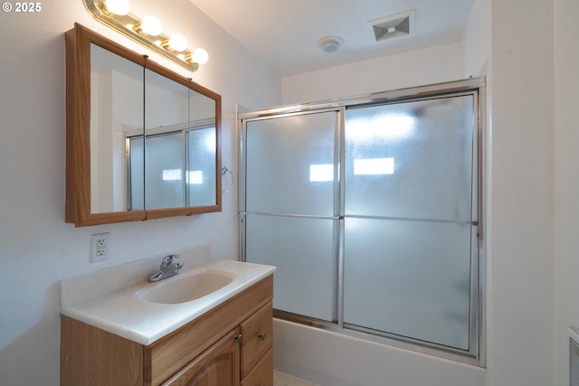 1108 4th St, Tillamook, OR 97141 - bathroom with vanity and shower / bath combination with glass door