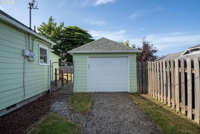 1108 4th St, Tillamook, OR 97141 - detached garage with driveway and a gate