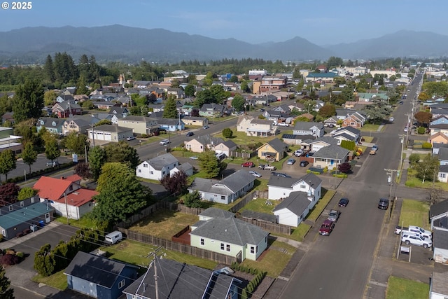 1108 4th St, Tillamook, OR 97141 - aerial perspective of suburban area featuring a mountain backdrop