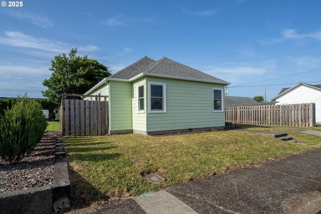 1108 4th St, Tillamook, OR 97141 - view of side of property with roof with shingles