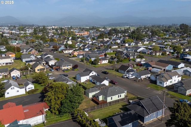 1108 4th St, Tillamook, OR 97141 - aerial view of residential area with a mountainous background