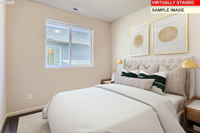 bedroom with carpet flooring, baseboards, and visible vents