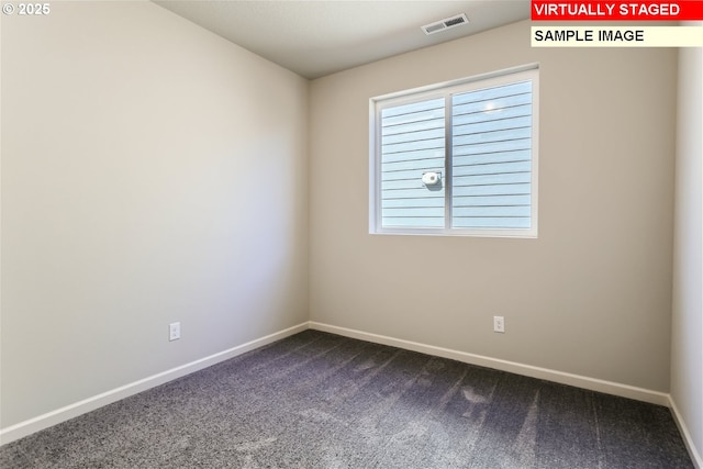 empty room featuring dark colored carpet, visible vents, and baseboards