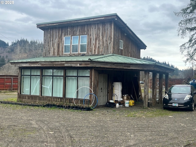 865 E Columbia River Hwy, Clatskanie, OR 97016 - view of front facade featuring board and batten siding and metal roof