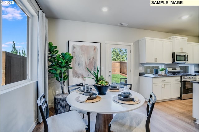 9388 SW Vermillion Dr Unit H235, Tualatin, OR 97062 - dining room with light wood-style floors and recessed lighting