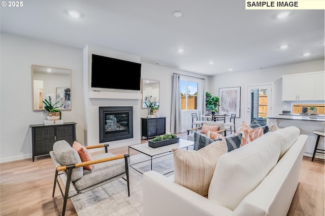 9388 SW Vermillion Dr Unit H235, Tualatin, OR 97062 - living area featuring light wood-style flooring, recessed lighting, and a glass covered fireplace