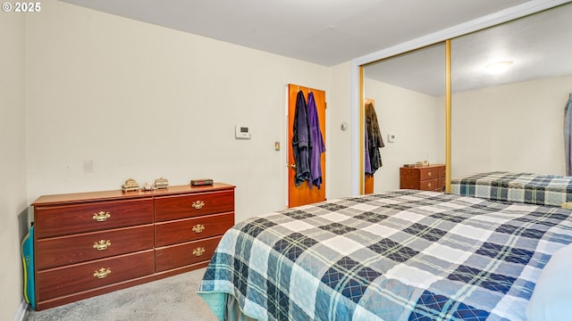 carpeted bedroom with a closet