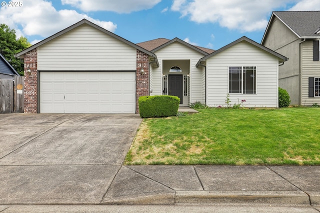 33333 Adam Ct, Scappoose, OR 97056 - single story home featuring a front lawn, concrete driveway, a garage, and brick siding