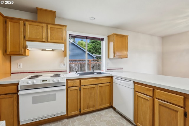 33333 Adam Ct, Scappoose, OR 97056 - kitchen featuring white appliances, a sink, under cabinet range hood, light countertops, and a peninsula