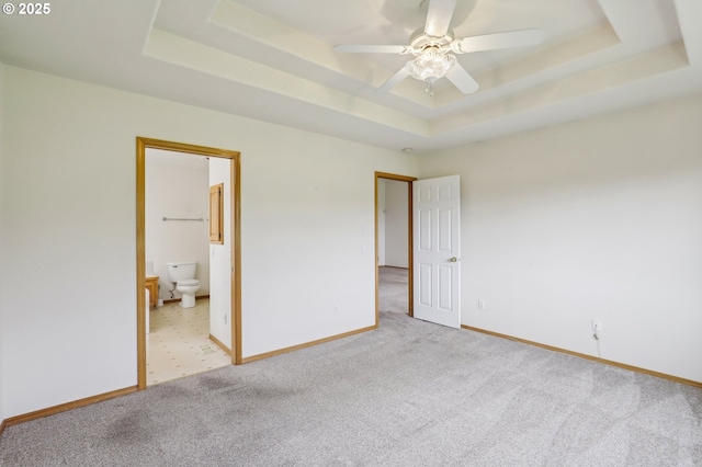 33333 Adam Ct, Scappoose, OR 97056 - unfurnished bedroom with a raised ceiling, carpet flooring, baseboards, and ensuite bath