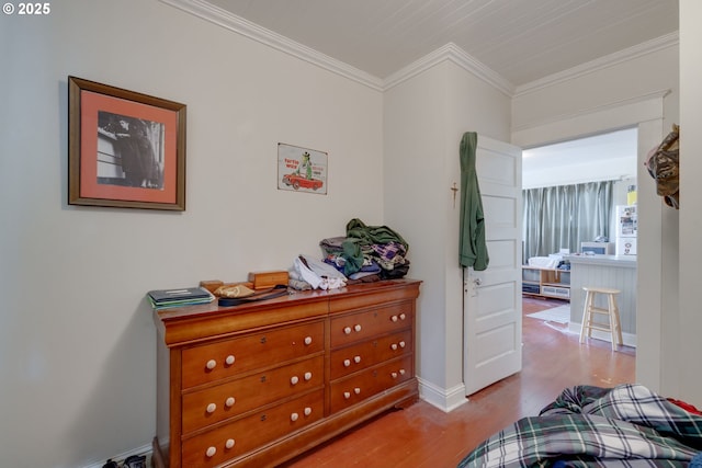 2977 Grand Ave, Astoria, OR 97103 - bedroom with wood finished floors, baseboards, and ornamental molding