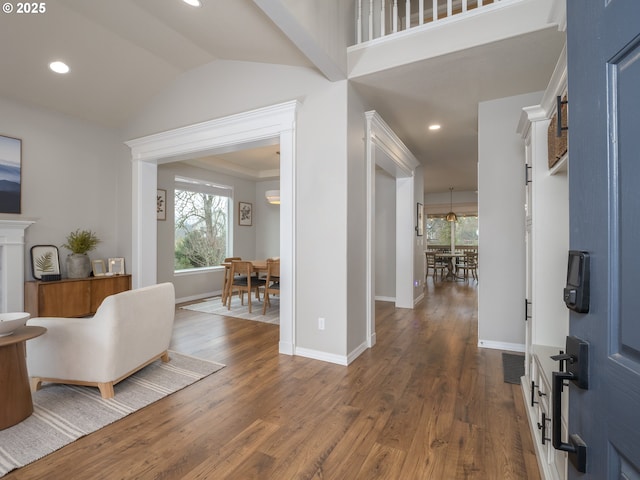 foyer featuring recessed lighting, baseboards, and dark wood finished floors