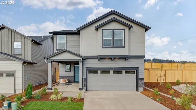 craftsman-style house with a garage and a front yard