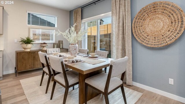 dining area with light hardwood / wood-style flooring